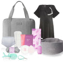 Gray travel bag containing Frida Mom essentials including postpartum clothing, pads, and hygiene products.