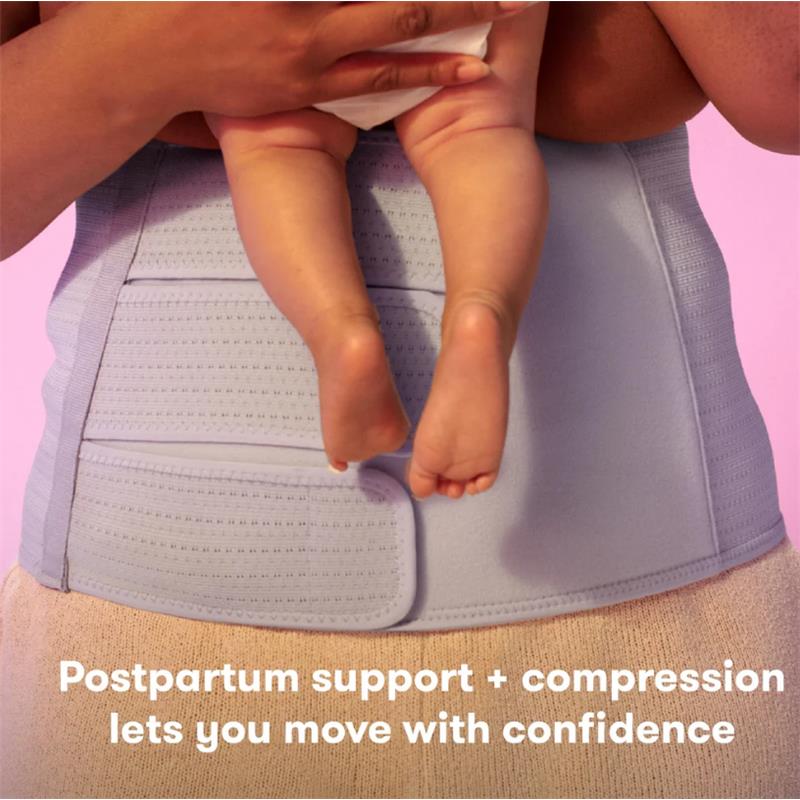 Frida Mom C-Section Recovery Kit featuring a postpartum support garment with adjustable compression, holding a baby.
