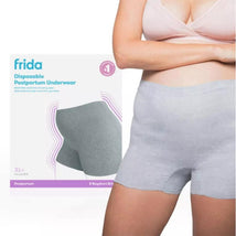Frida Mom disposable grey postpartum underwear in LX/XL size displayed on a model with packaging in the background.