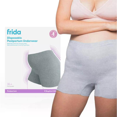 Frida Mom disposable grey postpartum underwear in LX/XL size displayed on a model with packaging in the background.