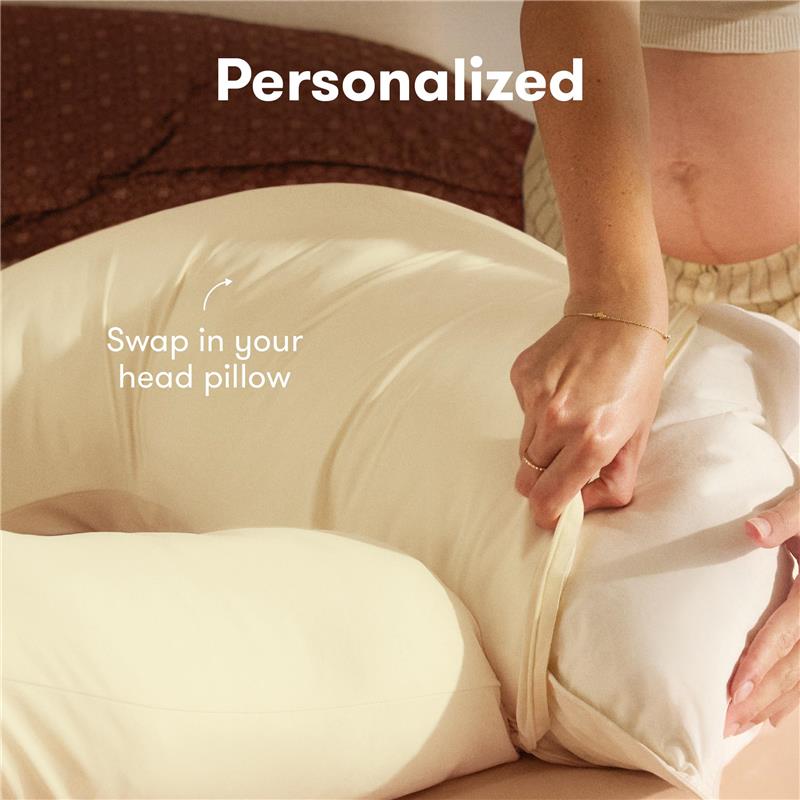 Frida Mom Full Body Support Cooling Pregnancy Pillow with a person adjusting the head pillow cover, featuring a zipper for customization.