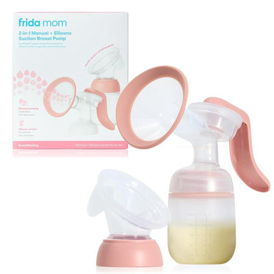 fridababy 2-In-1 Manual + Silicone Suction Breast Pump with a clear container and pink accents, displayed alongside its packaging.