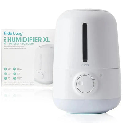Fridababy 3-in-1 XL Cool Mist Humidifier in white, with a control dial, packaged with instructions for use.