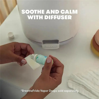 Fridababy 3-in-1 XL Cool Mist Humidifier with a person adding essential oil to a diffuser, promoting soothing effects.