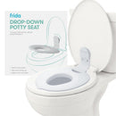 FridaBaby Drop Down Potty Training Seat for toddlers, designed to fit most toilets, shown mounted on a white toilet.