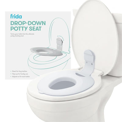 FridaBaby Drop Down Potty Training Seat for toddlers, designed to fit most toilets, shown mounted on a white toilet.