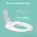 FridaBaby Drop Down Potty Training Seat, featuring suction cups for easy installation and an adjustable strap for most toilets.