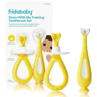 Fridababy Grow-with-Me Training Toothbrush Set in yellow, includes two toothbrushes and a removable safety stopper.