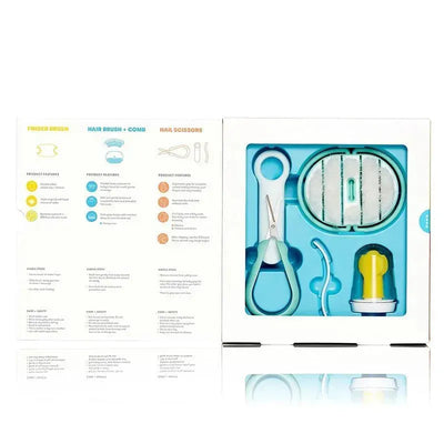 Infant grooming kit by Fridababy, including a finger brush, hair brush, comb, and nail scissors in a labeled package.