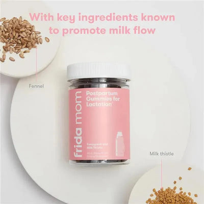 Fridababy postpartum gummies for lactation in a clear jar, with fennel and milk thistle seeds displayed on a light background.