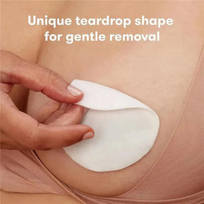 Cooling hydrogel nipple pad being gently removed from skin, showcasing its unique teardrop shape for comfort.