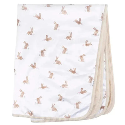 Plush blanket featuring a whimsical bunny pattern in soft colors, ideal for cozy comfort.