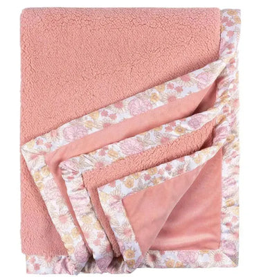 2-ply plush blanket in pink with a retro floral pattern along the edge, designed for girls.