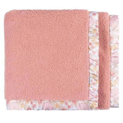 Plush blanket in soft pink with floral trim, designed for girls, offering cozy and stylish bedding.