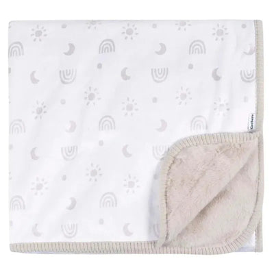 Plush two-ply blanket featuring a neutral rainbow design with subtle sun and moon motifs, edged with soft beige trim.