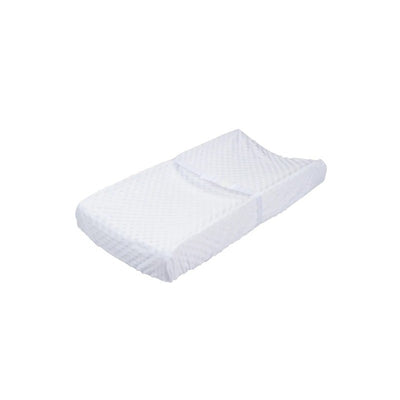 Neutral changing pad cover featuring a soft white texture with a quilted pattern, suitable for baby bedding.