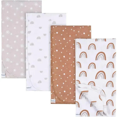 Four flannel blankets from Gerber featuring boho designs: one solid taupe, one with white flowers, one with white rainbows, and one with brown polka dots.