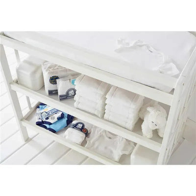Gerber 4-pack short sleeve bodysuits in white displayed on a white shelf, alongside folded diapers and a soft toy.