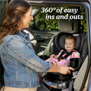 Graco EasyTurn 360 2-in-1 Rotating Convertible Car Seat in Cyran, with a smiling baby and a caregiver adjusting the seat.