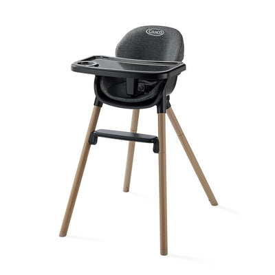 Graco Ready2Dine DLX 4-in-1 Highchair in gray, featuring a removable tray and wooden legs for portability and versatility.