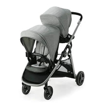 Graco Ready2grow Lx 2.0 Double Stroller in Clark, featuring two seats, adjustable canopies, and a sleek gray design.
