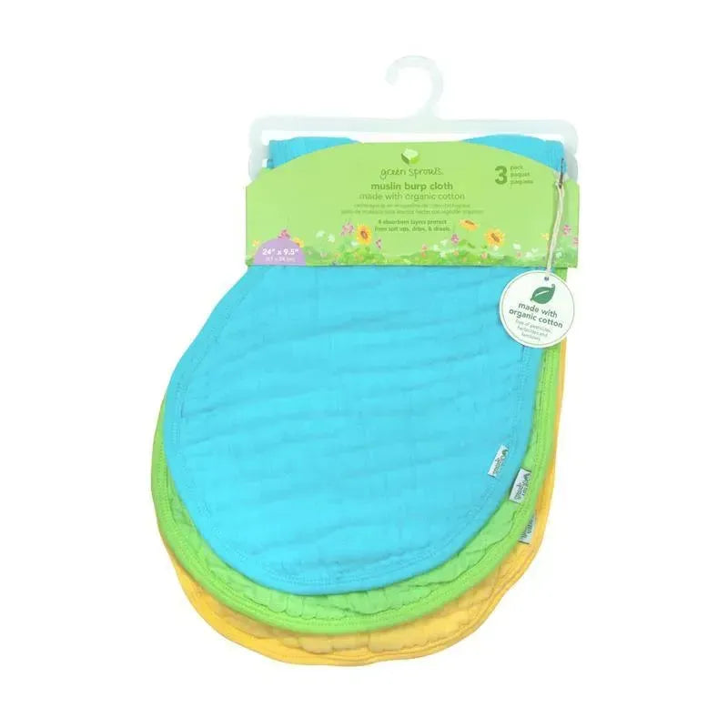 Three-pack of organic muslin burp cloths in blue, green, and yellow, featuring a hangtag with care instructions.