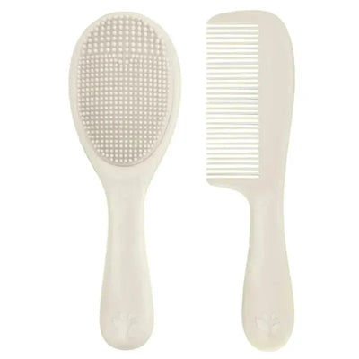 Cradle cap brush and comb set in light spice, featuring a textured brush and a fine-toothed comb for gentle scalp care.