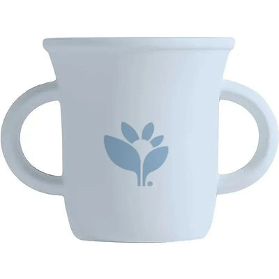 Light blueberry silicone learning cup by Green Sprouts, featuring two handles and a floral logo.