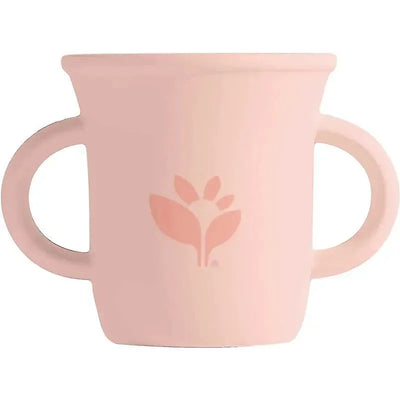 Silicone learning cup in light grapefruit color with two handles and a floral logo design.