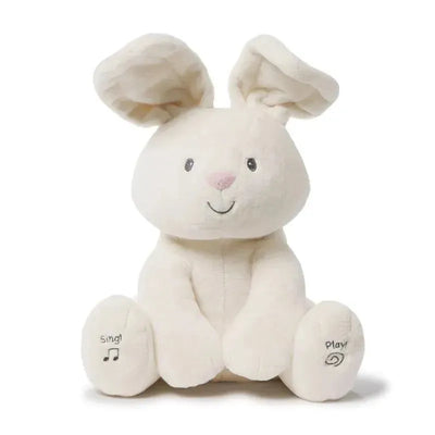 Animated plush bunny toy with a smiling face, floppy ears, and ‘Sing!’ and ‘Play!’ labels on its feet.