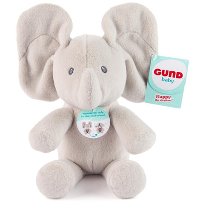 Flappy Elephant plush toy with oversized ears, soft gray fabric, and a tag instructing to squeeze the belly for peek-a-boo action.