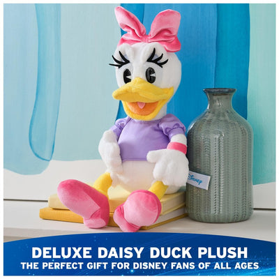 Daisy Duck plush toy in a purple shirt with a pink bow, sitting on stacked books beside a vase.