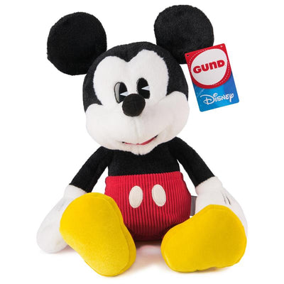 Gund Disney Mickey Mouse plush toy featuring black ears, a red body, and yellow shoes, with a tag showing the brand.