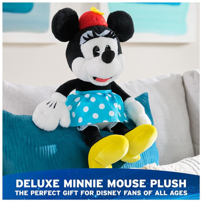Deluxe Minnie Mouse plush toy with a polka-dot skirt, smiling face, and yellow shoes, perfect for Disney fans.