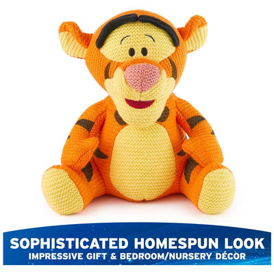 Knit plush Tigger from Winnie the Pooh, featuring an orange body and black stripes, with a friendly expression.