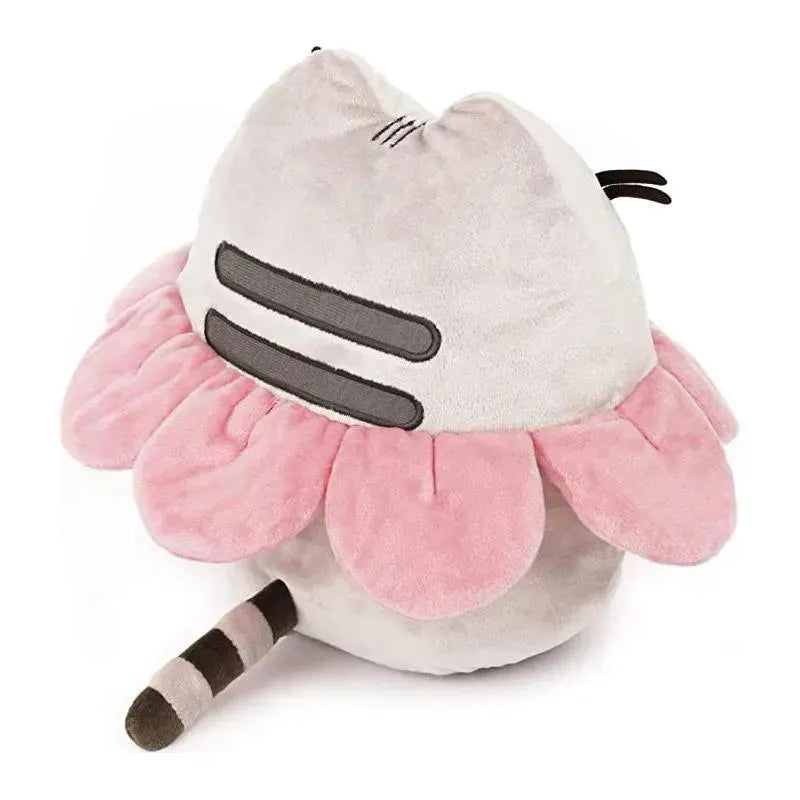 Plush Gund Pusheen toy featuring a gray cat adorned with a pink flower petal collar and a striped tail.