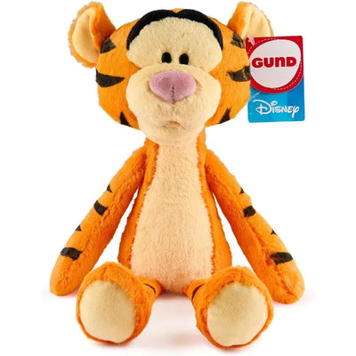 Plush Tigger toy by Gund, featuring orange fur, black stripes, and a hanging tag with brand logo.