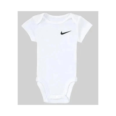 White Nike Mini Me bodysuit with short sleeves and a black Nike swoosh logo on the front.