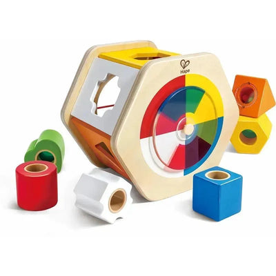Wooden Wonder Shape Sorter by Hape featuring a hexagonal shape, colorful geometric blocks, and a spinning color wheel.