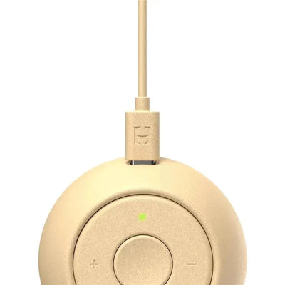 Portable sound machine for babies, Honey color, featuring volume control and green indicator light.