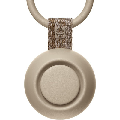 Hatch Go Portable Sound Machine in greige color, featuring a circular design and fabric loop for easy carrying.