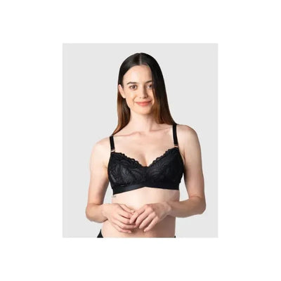 Black wirefree nursing bra with soft cup and lace detailing, modeled by a woman smiling in a neutral background.