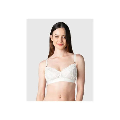 Wirefree ivory nursing bra with soft cups and lace detailing, modeled by a smiling woman.