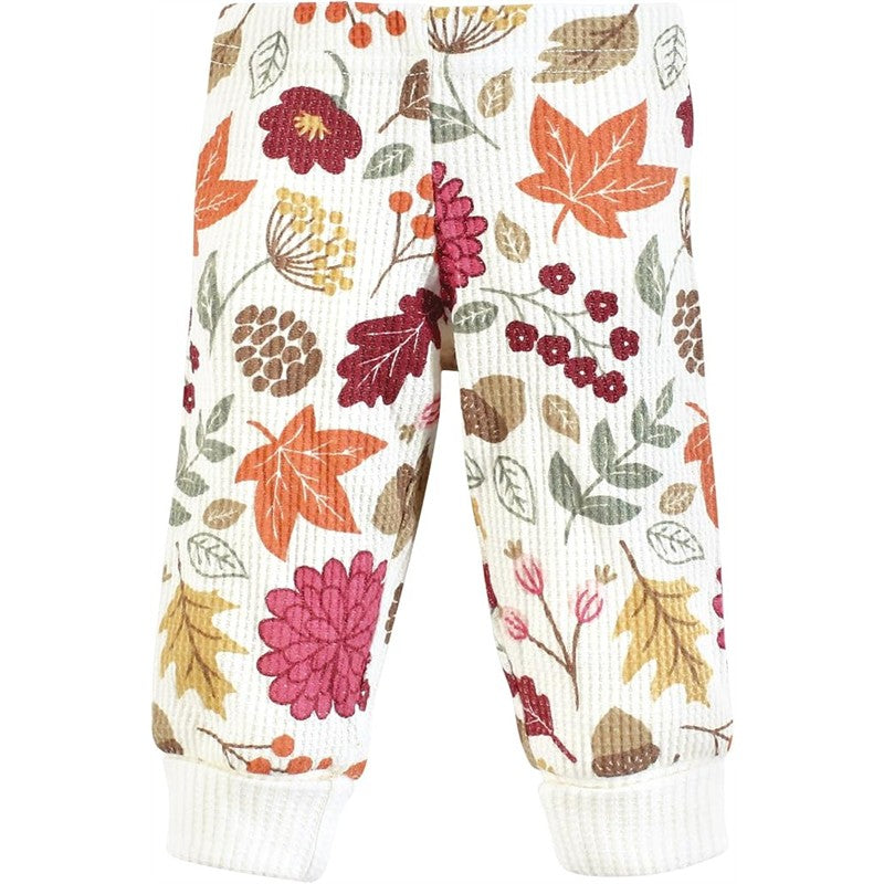 Thermal baby pants featuring an acorn botanical pattern with colorful flowers and leaves in autumn shades.