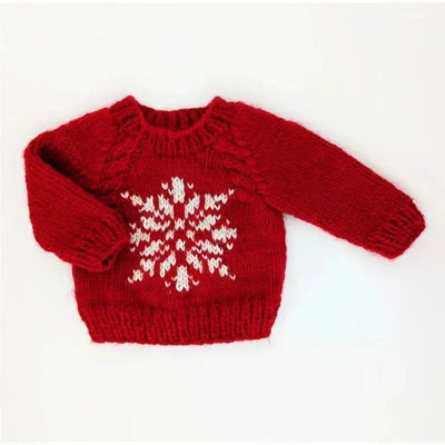 Red crew neck sweater for babies and toddlers, featuring a white snowflake design on the front.