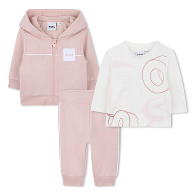 Hugo Boss Baby 3-pack girl tracksuit and tee set in pale pink, featuring a zip-up hoodie, pants, and a graphic tee.