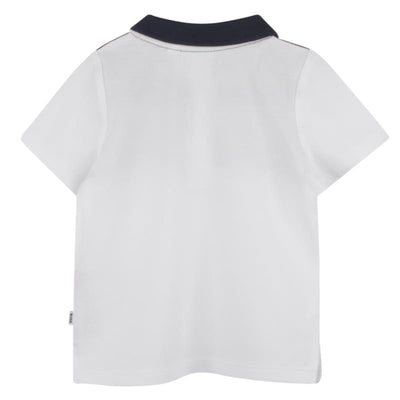 Colorblock short sleeve polo in white, beige, and navy, featuring a navy collar and tag on the side.