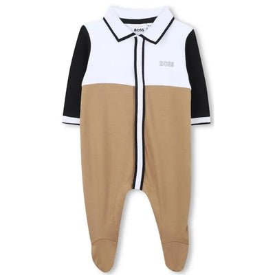 Beige polo footie for boys by Hugo Boss, featuring a white and black color-block design and a collar.