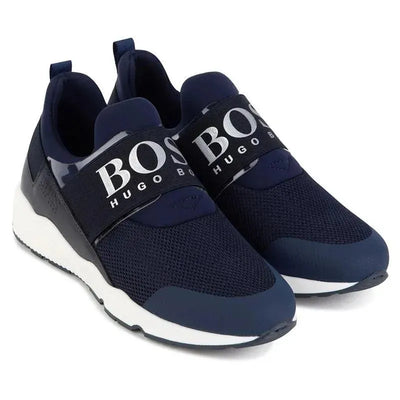 Black Hugo Boss baby boy sneakers featuring a mesh design, elastic strap with logo, and white sole.