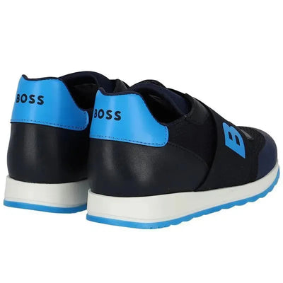 Navy Hugo Boss Baby sneakers with elastic strap and blue logo detail on the heel.
